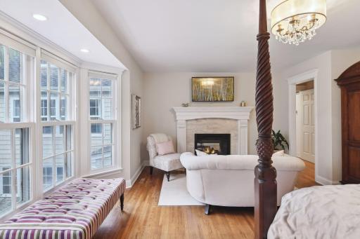 Main floor primary bay window overlooking beautiful backyard