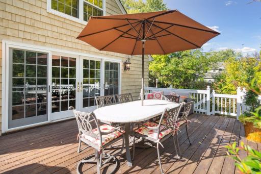 Sliding French double doors off the main floor family room lead to a large two tier deck