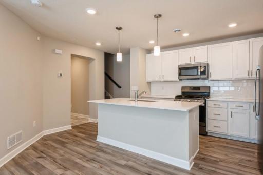 Thoughtfully-designed, modern and fresh describe this kitchen. (Photos are not of actual home. Actual home will be similar. Some colors and features may vary.)