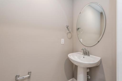 Conveniently located half bath on the main level. *Photos are of another home, colors and finishes may vary.