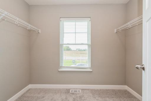 Spacious Primary Suite Closet! *Photos are of another home, colors and finishes may vary.