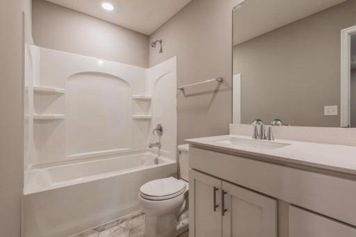 The home's secondary bath features a vanity with extra space to help keep everyone moving during those busy mornings. *Photos are of another home, colors and finishes may vary.