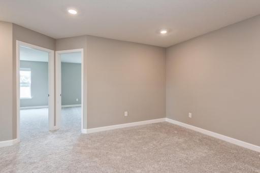 Located on the upper level, this perfectly sized living space has enough room for a desk, television and seating for all. Plus, it is just steps away from all three bedrooms. *Photos are of another home, colors and finishes may vary.