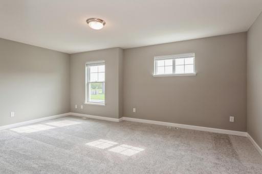 Large primary suite with private bathroom and walk in closet! *Photos are of another home, colors and finishes may vary.