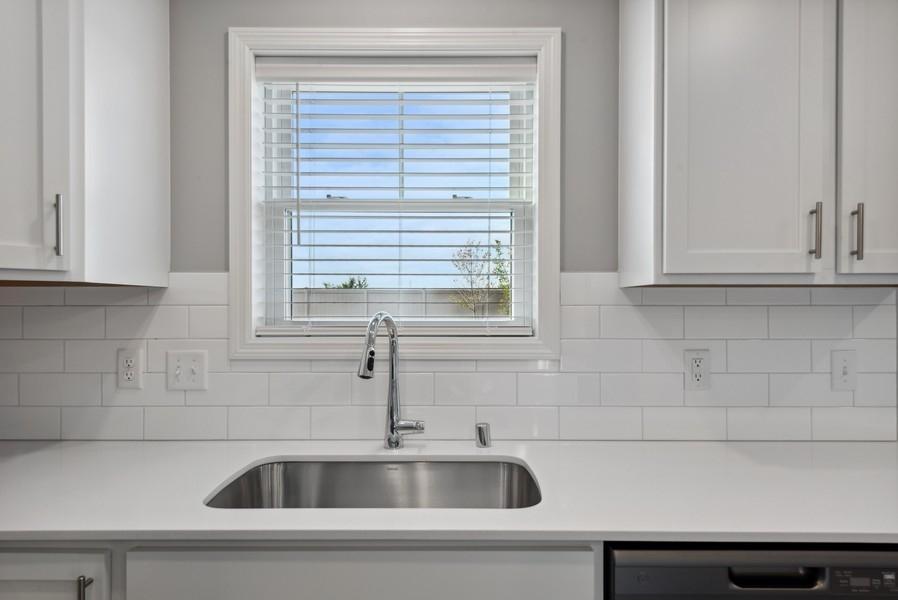 Single sink provides and easier way to wash your large pots and pans. Plus, it's conveniently located next to the included dishwasher. (Photo of a completed home, actual home's finishes may vary slightly)