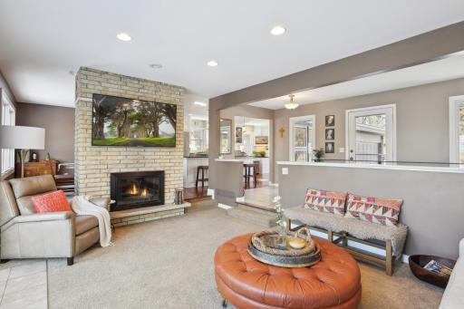 Stellar brick fireplace separates the living room from the dining room.