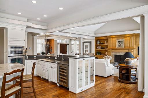 The peninsula has 2 beverage drawers, a wine chiller, a sink with 3/4 hsp garbage disposal and glass cabinets for your bar ware.