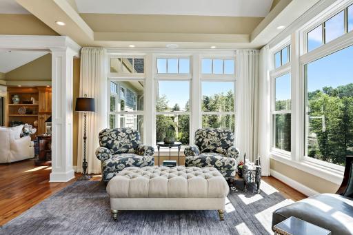 Another view of the sun room which is surrounded by lovely views.
