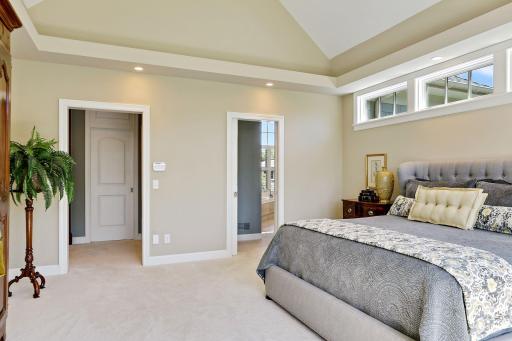 The door to the left leads to the owners' closet which can also be accessed from the bath. The door to the right leads to bathroom.