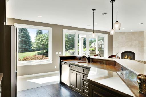 The wet bar has a beautiful chocolate marble top. There's also a built-in microwave.