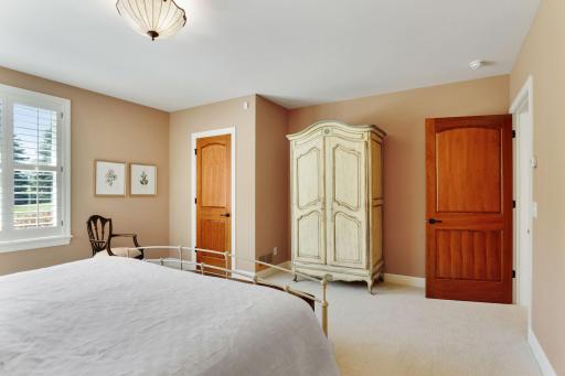 Another view of bedroom. The walk-in closet has an organizer.