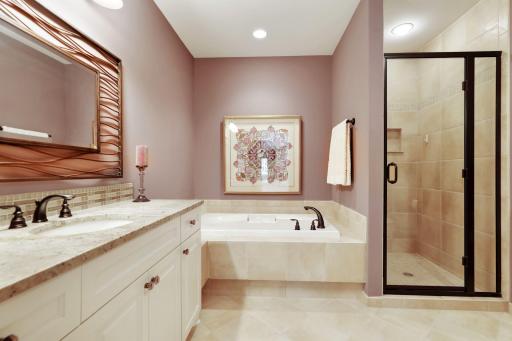 The west bedroom bath with Jacuzzi tub and shower.