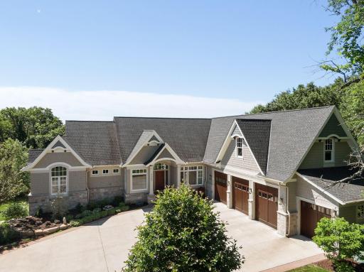 Great curb appeal with flared gable tails and accented with corbels. 4 car garage with three 10' doors.