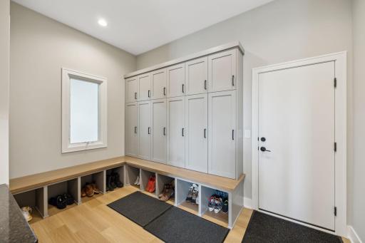 Garage entry mudroom with 6 custom storage lockers