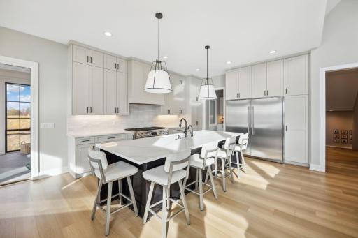 Gourmet eat-in kitchen features quartz countertops