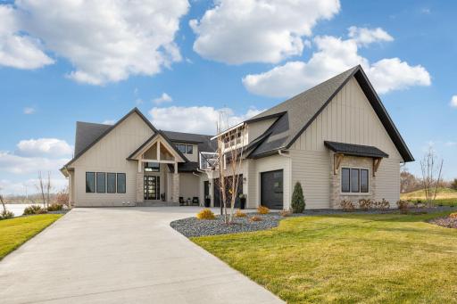 Featuring a large concrete driveway, leading to the 4 car 1,600 sq ft garage, with additional storage above!
