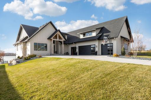 Welcome to 25602 Cedar Lane in New Prague, a 2022 Moderno built masterpiece!