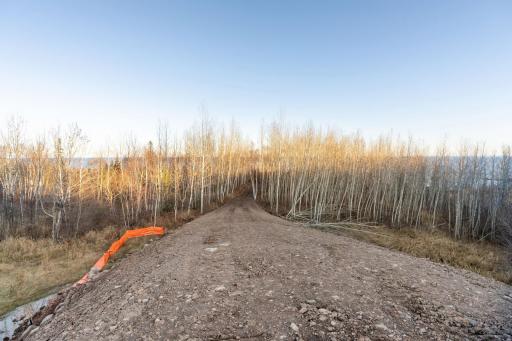 Drive way looking down towards the cleared lot for home site