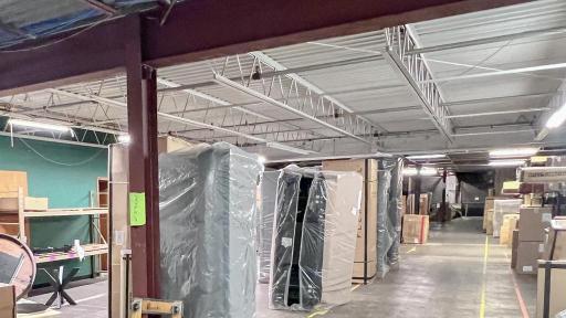 310 34th Ave W Alexandria, MN 56308 Warehouse wraps around the retail area with full lighting.