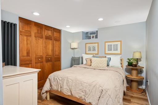 Escape to the finished basement bedroom, where thoughtful design meets comfort, offering a cozy haven adorned with modern finishes and the allure of an additional living space below ground.