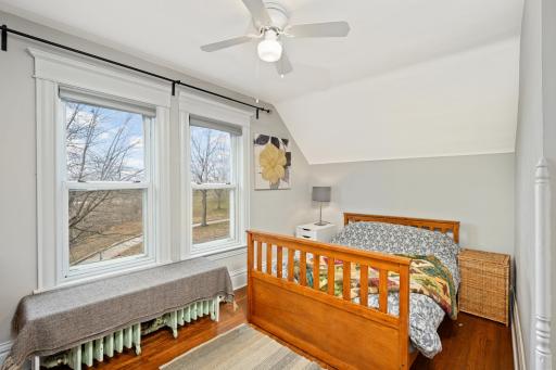 Retreat to the first bedroom, where panoramic views of the adjacent park and lake create a tranquil haven, inviting you to wake up to nature's beauty every morning.
