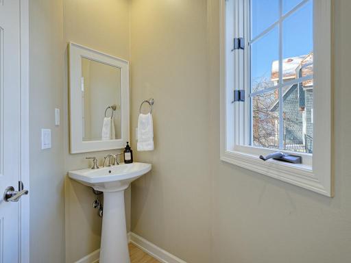 Main floor powder room is perfect for guests.