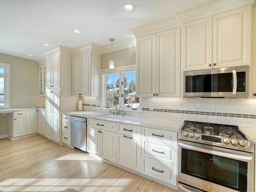 Tons of cabinetry and quartz countertops.