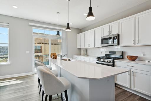 Imagine entertaining your friends and family in this functional timeless design for years to come! (Photo of decorated model, actual home's finishes may vary slightly)