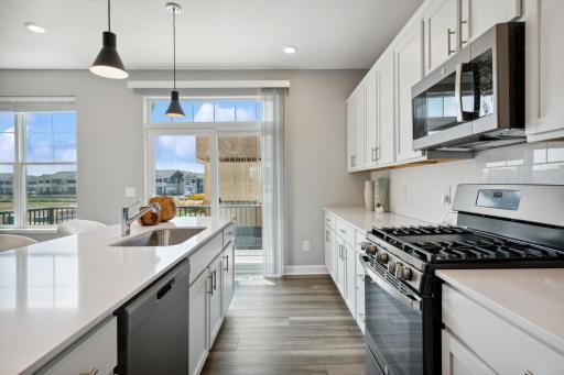 You'll always have more than enough counterspace! (Photo of decorated model, actual home's finishes may vary slightly)