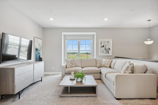 The family room is both cozy and contemporary. (Photo of decorated model, actual home's finishes may vary slightly)