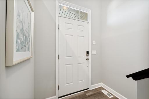 Make the best first impression with this bright and open foyer. (Photo of decorated model, actual home's finishes may vary slightly)