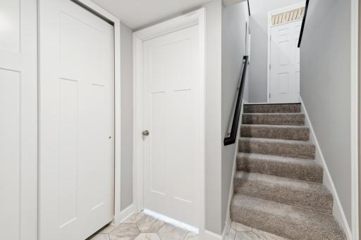 This spectacular owner's entry provides a spacious closet for boats, boots and other seasonal items. (Photo of decorated model, actual home's finishes may vary slightly)