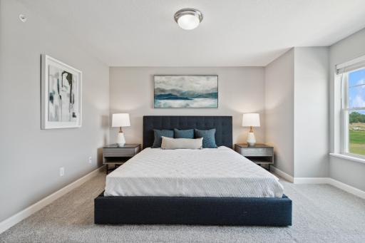 Spacious, imaginative and modern would best describe this owner's suite. (Photo of decorated model, actual home's finishes may vary slightly)