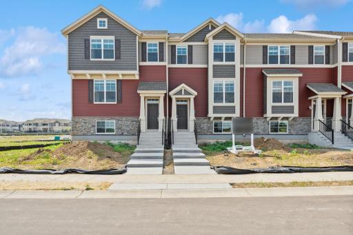 A stunning display from the street, introducing our Ontario plan. This home comes complete with irrigation, landscaping, trees and a full yard of sod! (Photo of a completed home, actual home's finishes may vary slightly)