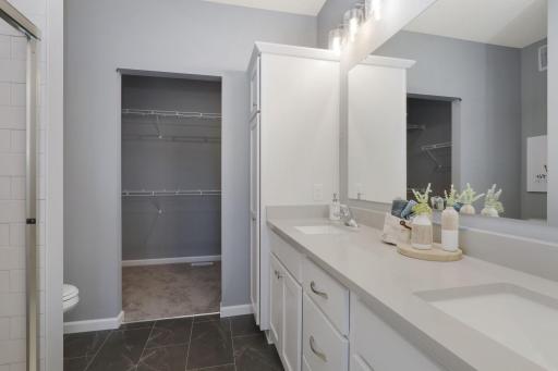 Photos of a similar home - finishing may be different - owners bath and walk-in closet