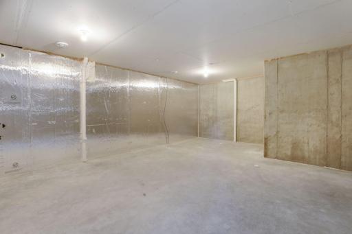 Unfinished flex space on lower level - ready for your ideas - exercise room? home theater? workshop? storage!