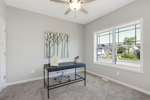 2nd bedroom on the main floor - located at front of home affording privacy for guests or as a home office