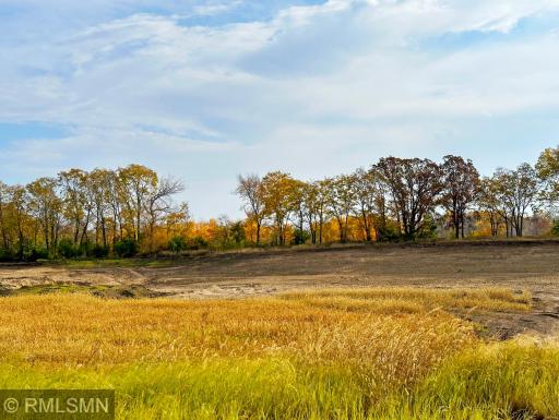 Gorgeous lot spanning across rolling countryside with stunning views of nature and Lake John.