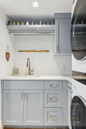 Laundry will soon become a labor of love. Equipped with top of the line LG appliances, this space offers modern efficiency for your laundry needs. The utility sink provides added practicality.