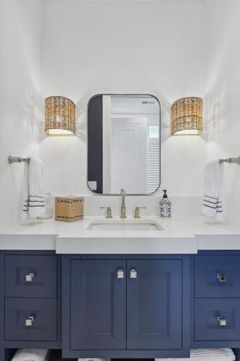 The jack and Jill bathroom is stunning, boasting modern fixtures and tasteful finishes. Your guests may never wish to leave!