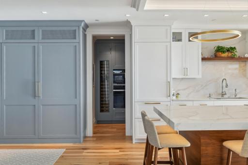 The pantry is conveniently located behind the kitchen and will easily house your extras! The Sub Zero designer wine refrigeration system is a very nice touch!
