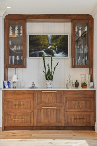We love how the glass cabinets are sleek and provide a showcase for cherished items.
