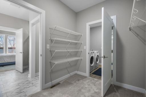 Primary Bedroom Walk In Closet into Laundry