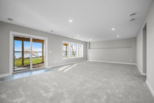 Large Family Room with Sliding Glass Door and Large Windows