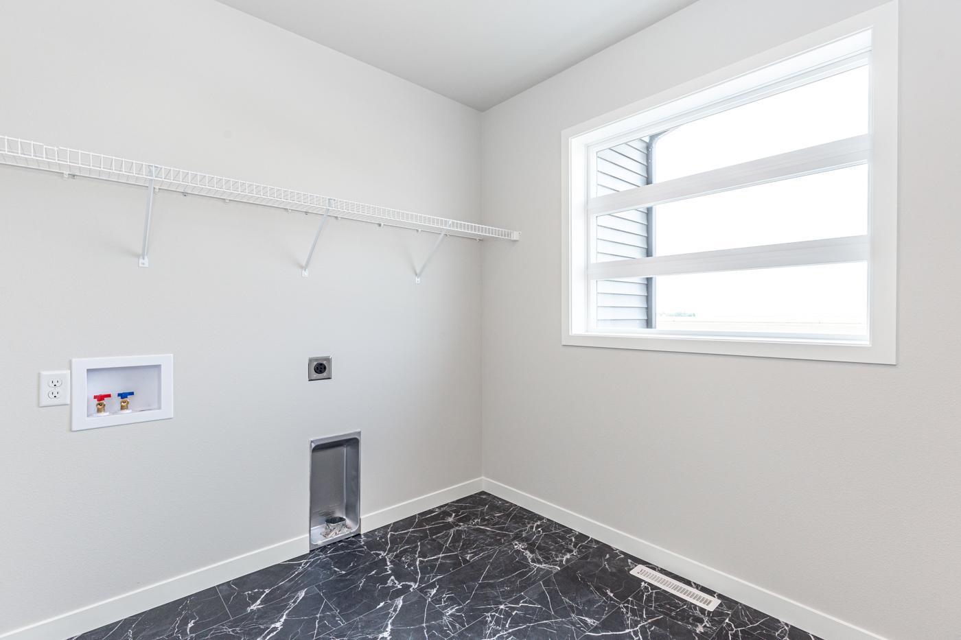 2nd Floor Laundry - LVT flooring with plenty of natural light