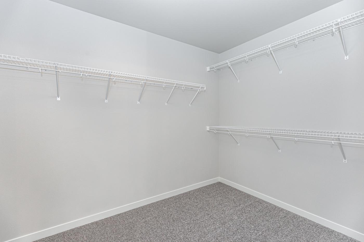 Primary Closet - Spacious primary walk-in closet!