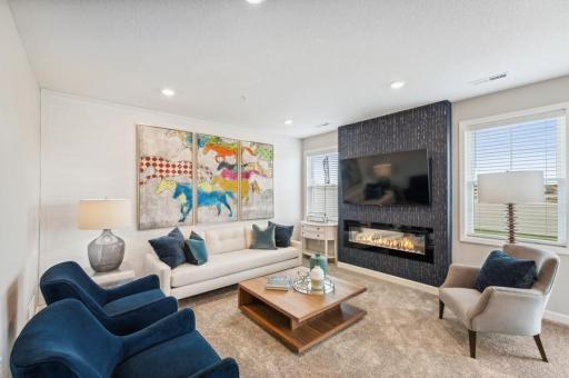 This beautiful family room is both cozy and contemporary! (Photo of decorated model, actual home's finishes may vary slightly)