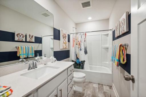 This spacious upper level bath provides plenty of space for everyone to get ready during those busy mornings. (Photo of decorated model, actual home's finishes may vary slightly)