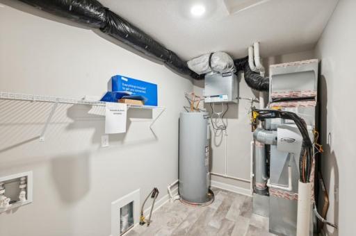 Mechanical and laundry room. (Photo of decorated model, actual home's finishes may vary slightly)