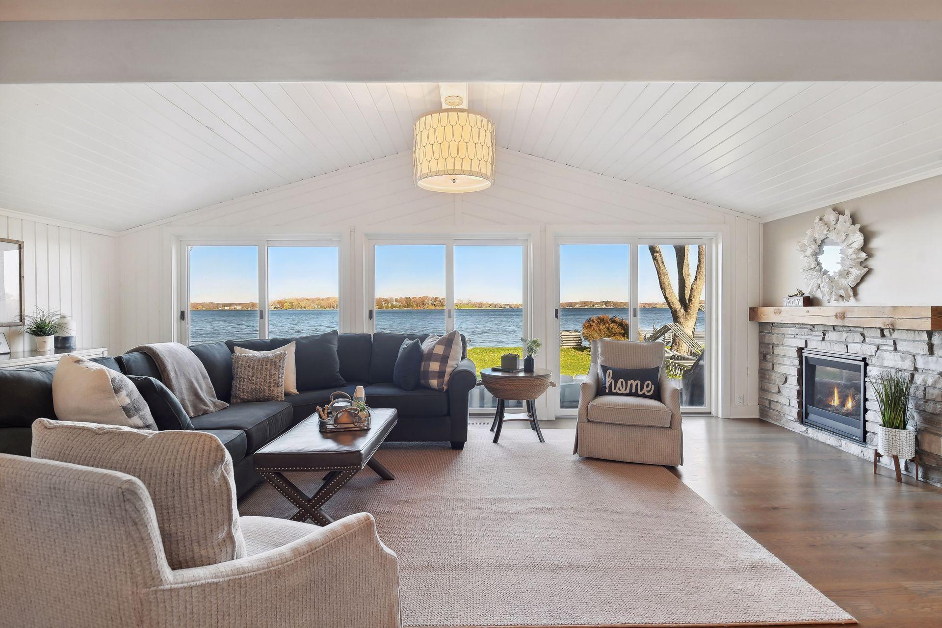Fantastic main floor family room with easy access to the outdoor living spaces and lovely water views.